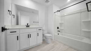Full bathroom featuring vanity and washtub / shower combination