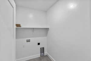 Laundry area featuring hookup for a washing machine and hookup for an electric dryer