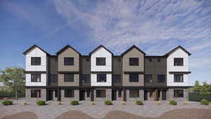 Contemporary house with brick siding and stucco siding