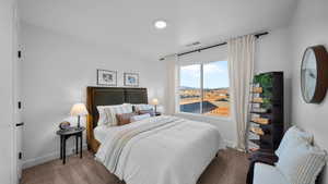 Carpeted bedroom with baseboards