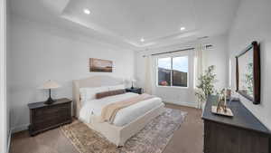 Carpeted bedroom with baseboards and recessed lighting