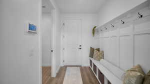 Mudroom featuring light wood finished floors