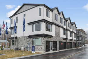 View of building exterior featuring a garage