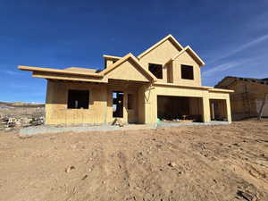 Property in mid-construction with stucco siding