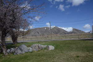 View of mountain background featuring rural landscape