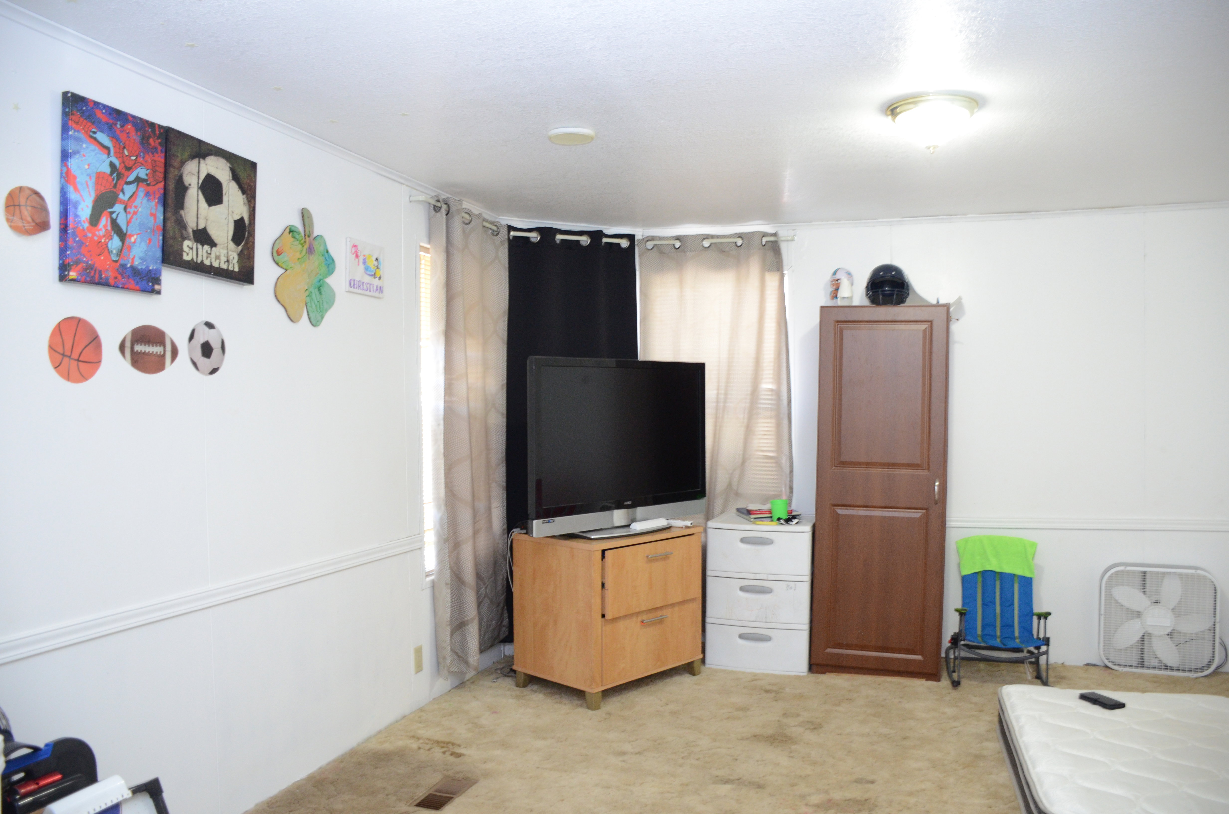 Bedroom with light colored carpet
