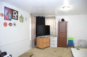 Bedroom with light colored carpet