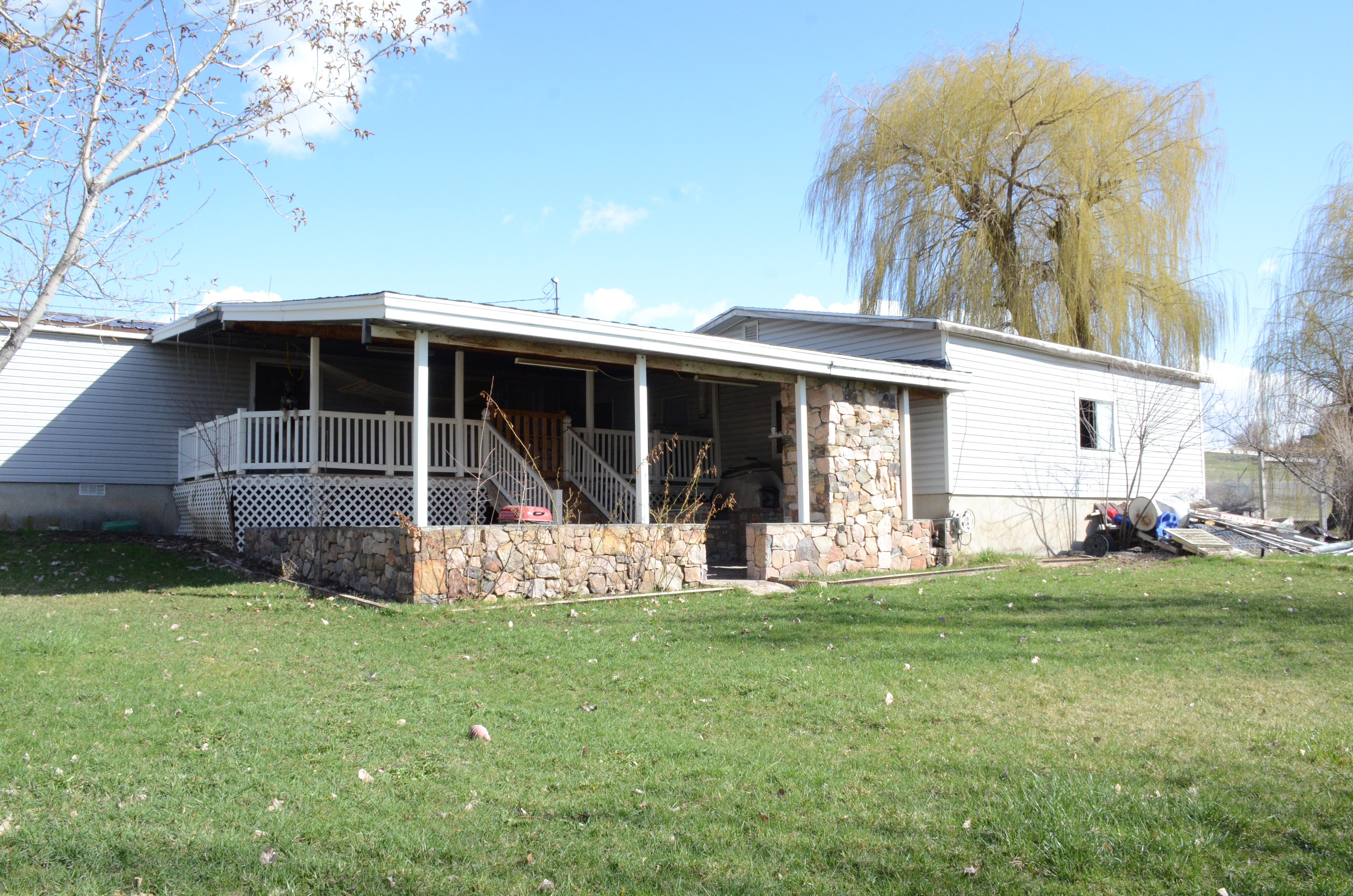 Rear view of property featuring a yard