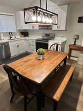 Dining room with dark wood-type flooring