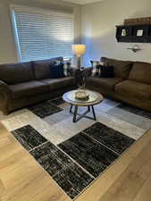 Living area featuring wood-type flooring