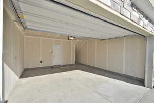 View of garage.  Property has 4 parking spots total, 2 in the garage and 2 behind.