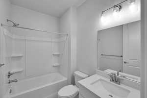Full bathroom with washtub / shower combination and vanity