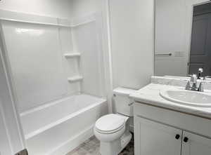 Bathroom featuring vanity and bathing tub / shower combination