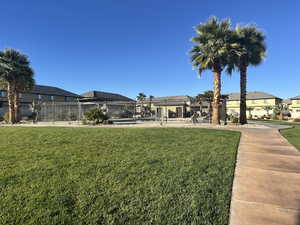 View of yard with a residential view and a pool