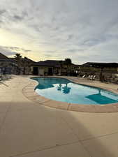 Community pool featuring a patio