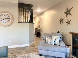 Living area featuring wood finished floors and baseboards