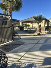 View of patio featuring a gate