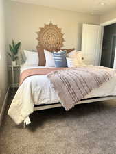 Carpeted bedroom with baseboards