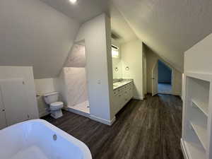 Bathroom with double vanity, a soaking tub, and shower.