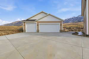 Garage with a mountain view and driveway