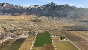 Overview of rural landscape with a mountain backdrop
