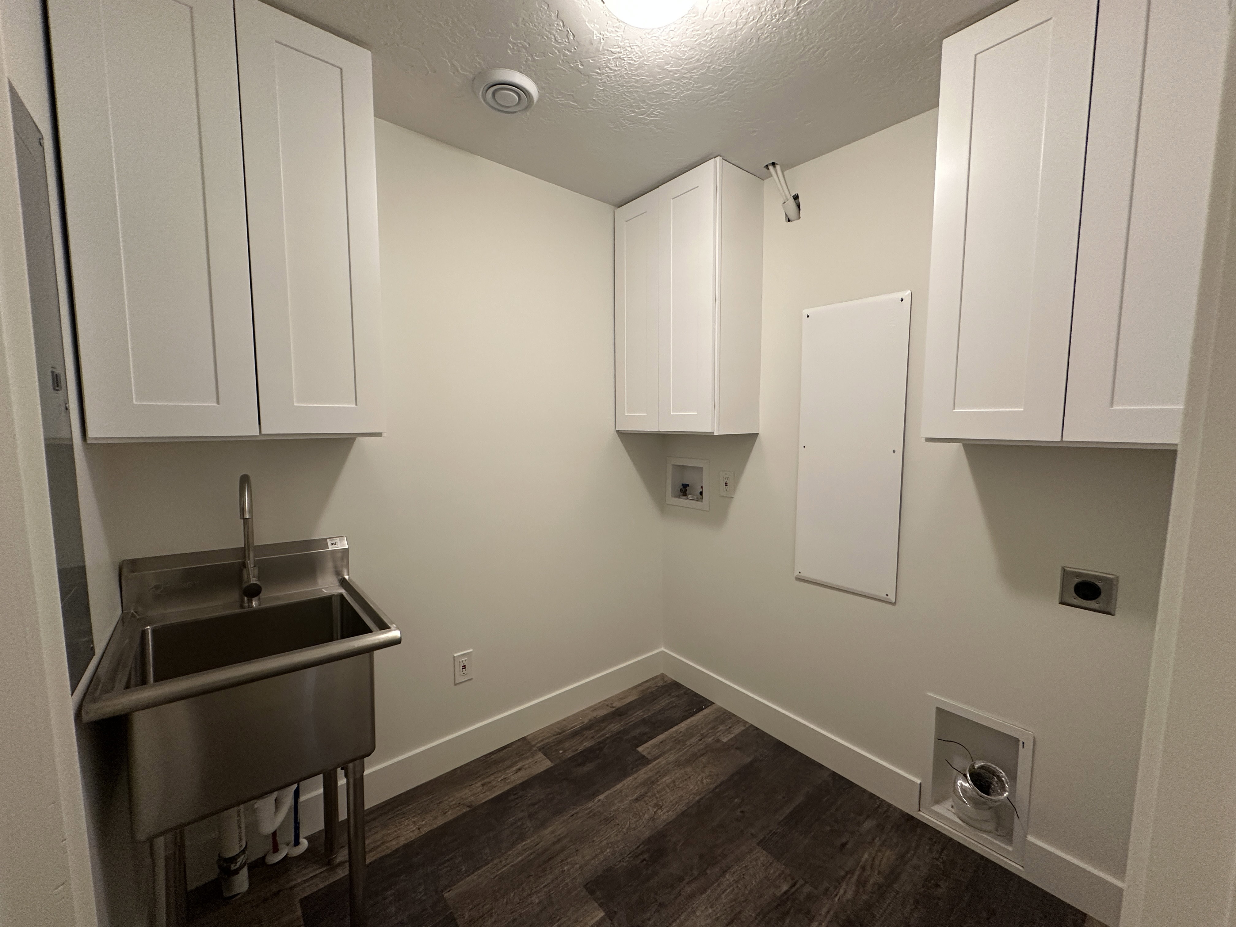 Laundry room with cabinets for storage