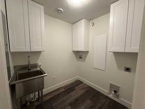 Laundry room with cabinets for storage