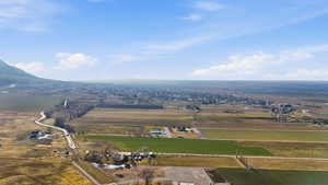 Overview of rural landscape featuring large plots for crops