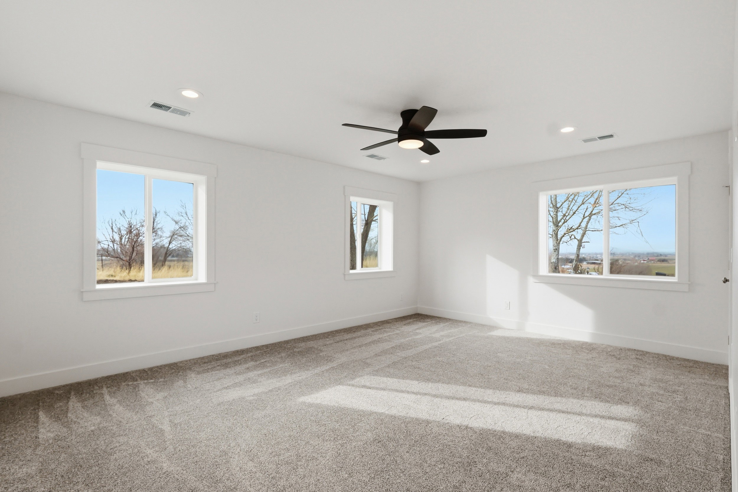 Master bedroom with large walk in closet and views of the mountains and valley