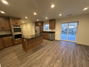 Kitchen and dining area with sliding door to back yard.