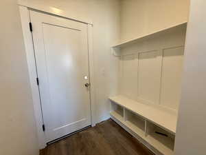 Mudroom featuring dark wood-style flooring