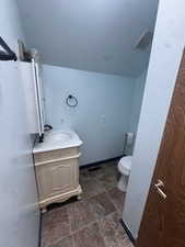 Bathroom with vanity and a textured ceiling