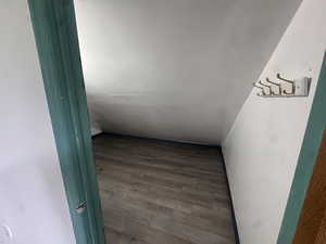 Spare room featuring wood finished floors
