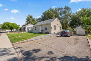 Bungalow-style house featuring a shed and driveway