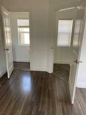 Unfurnished room featuring dark wood finished floors