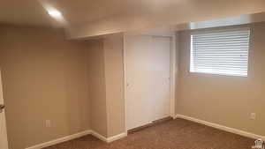 Below grade area with carpet floors and baseboards