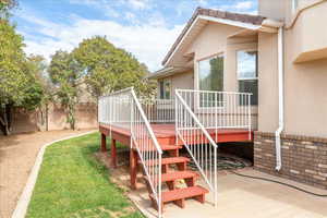 Deck featuring stairway and a patio