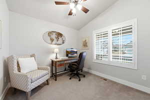 Office area featuring lofted ceiling, carpet, and ceiling fan