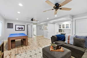 Playroom featuring light wood-style flooring, a ceiling fan, and recessed lighting