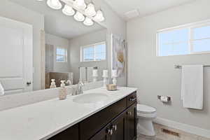 Bathroom with vanity and light tile patterned floors