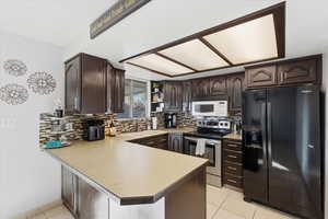 Kitchen featuring dark wood finish cabinetry,
