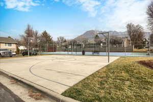 View of basketball court with community basketball court and a mountain view