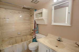 Full bathroom with vanity and shower / bath combination with curtain