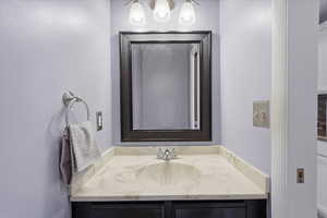 Bathroom with vanity on main level.