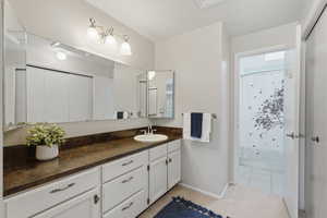 Vanity in master with large closet. Great lighting and plenty of storage.