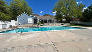 Community pool with a patio area