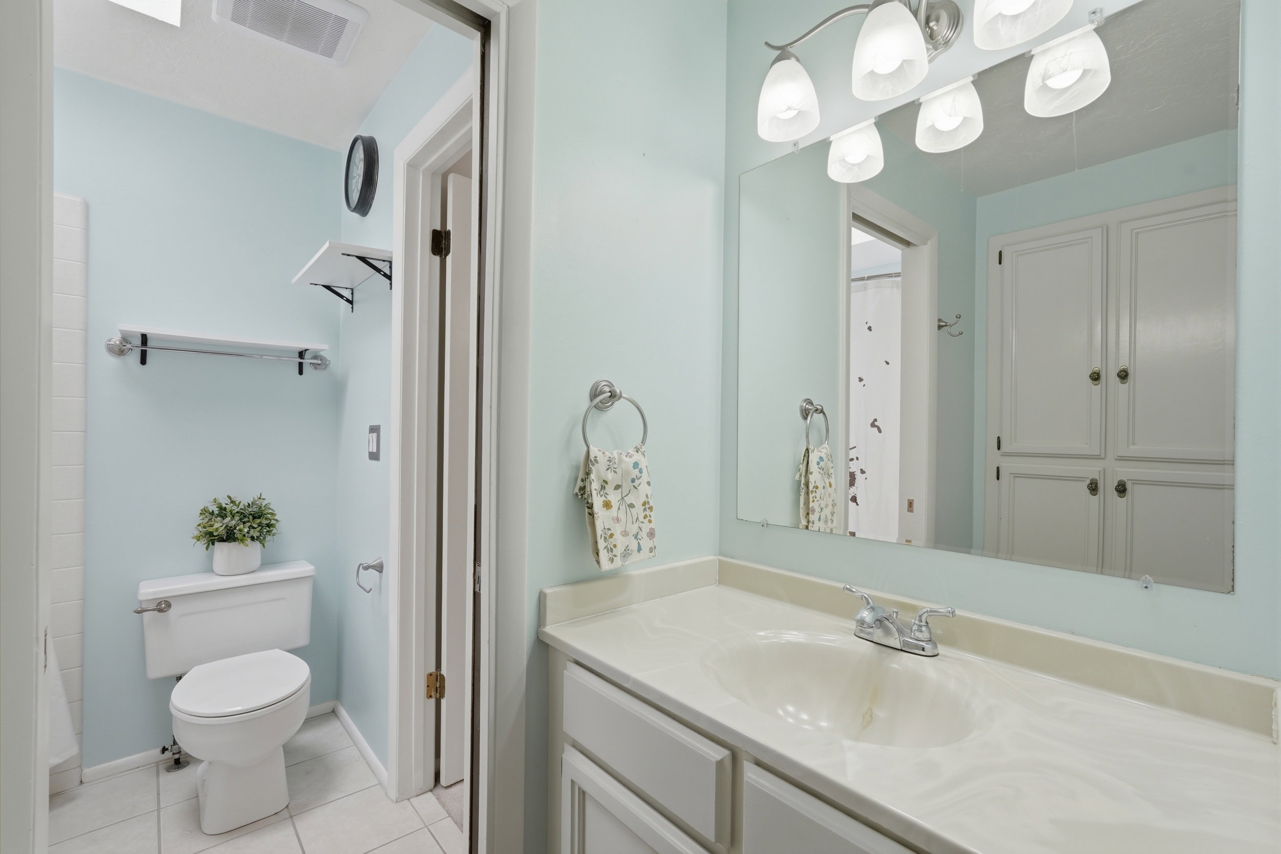 Bathroom with built in storage and huge garden tub.