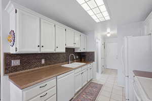 Leads to laundry, half bath and garage.