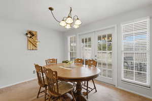 Dining room with great lighting and French doors that lead to private patio.