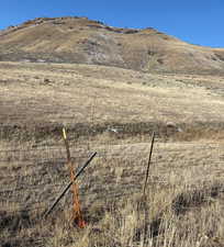 View of mountain background featuring rural landscape